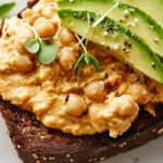 Spicy Chickpea Avocado Toast with Microgreens & Sesame Seeds